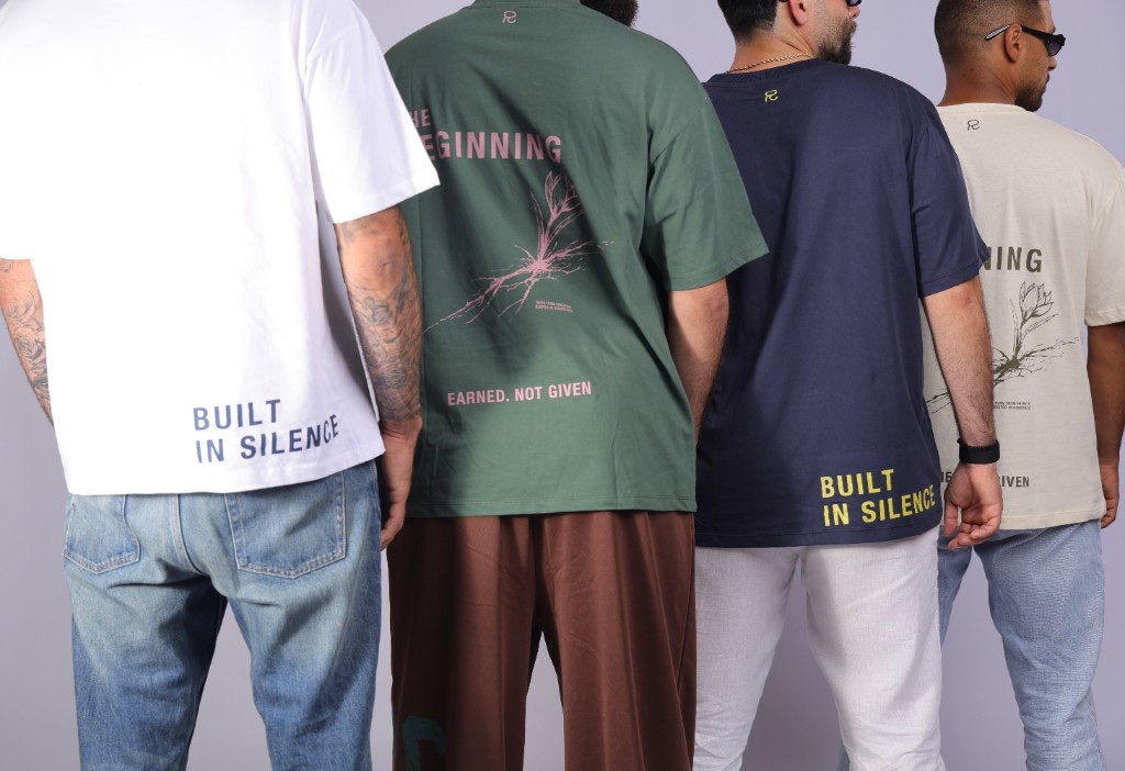 Four Relentless tees from behind, one printed BUILT IN SILENCE