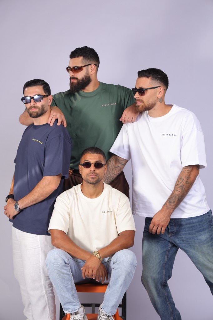 The Relentless crew standing together in tees from the drop